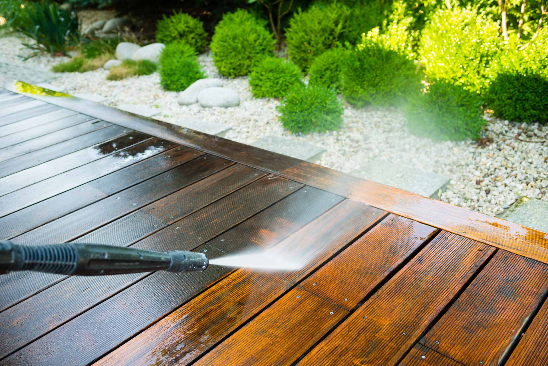 Pressure washing a wooden deck