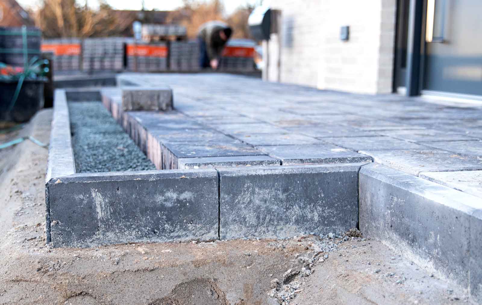 In-progress concrete paver patio construction