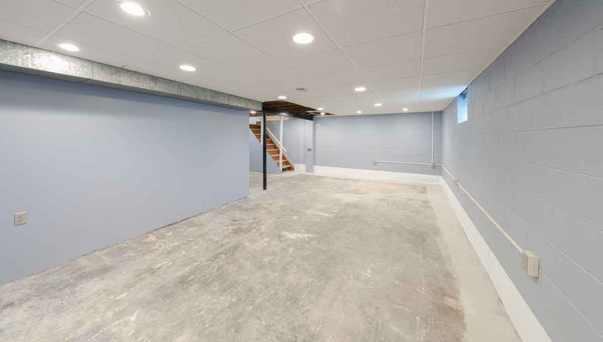 Newly waterproofed basement with water damage repaired